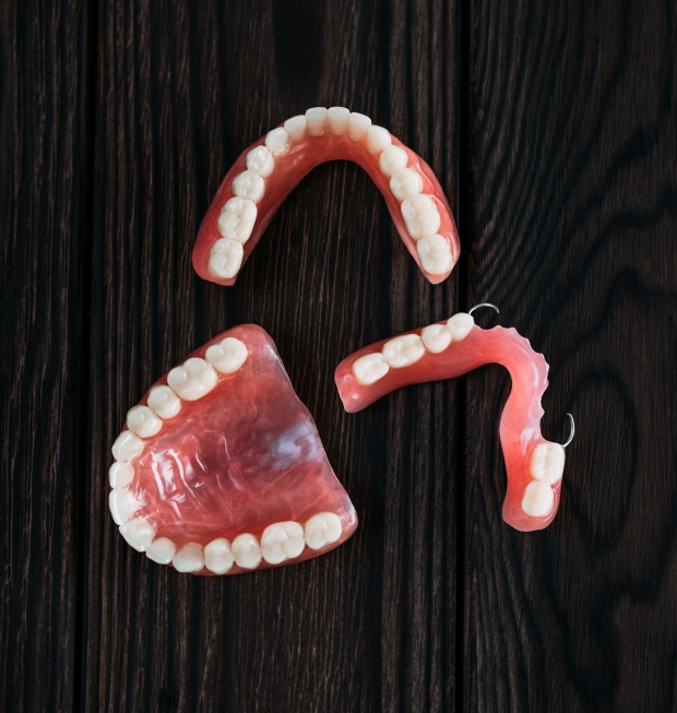 Partial dentures displayed on a dark background
