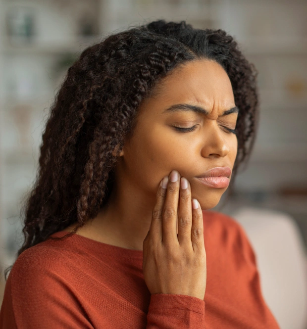 Woman experiencing a dental emergency