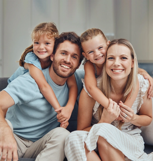 Happy family smiling together at Core Dentistry