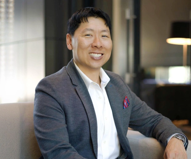 Dr. Daniel Kou smiling in the dental office