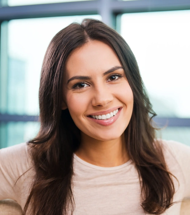 Woman smiling confidently after treatment
