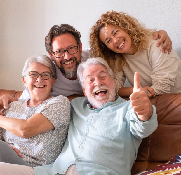 Multi generational family posing for a photo