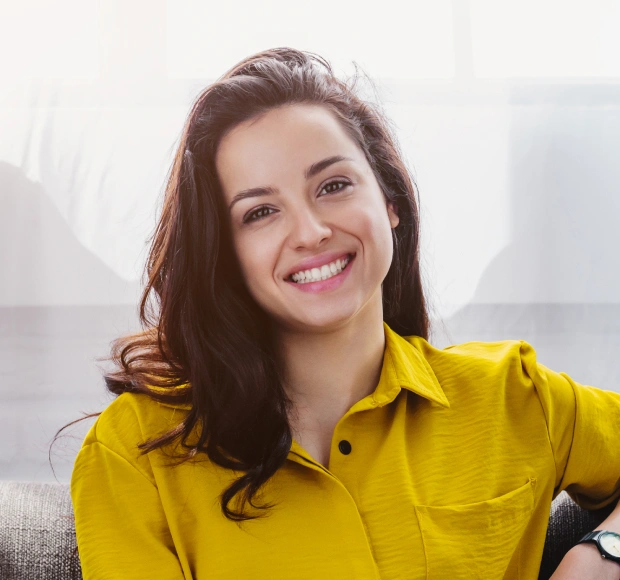 Smiling patient sitting in dental office
