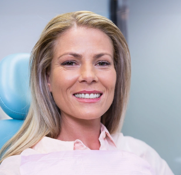 Woman smiling after periodontal therapy treatment