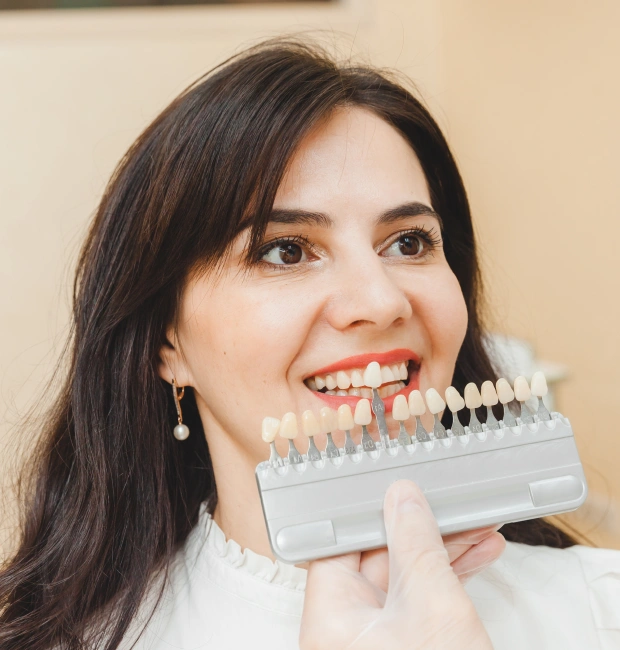 Woman smiling with porcelain veneers