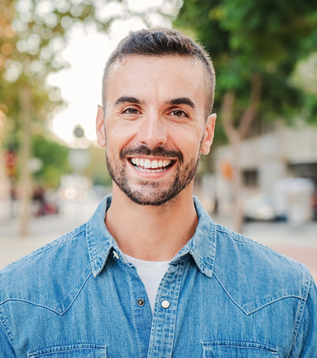 Man smiling after restorative dentistry treatment