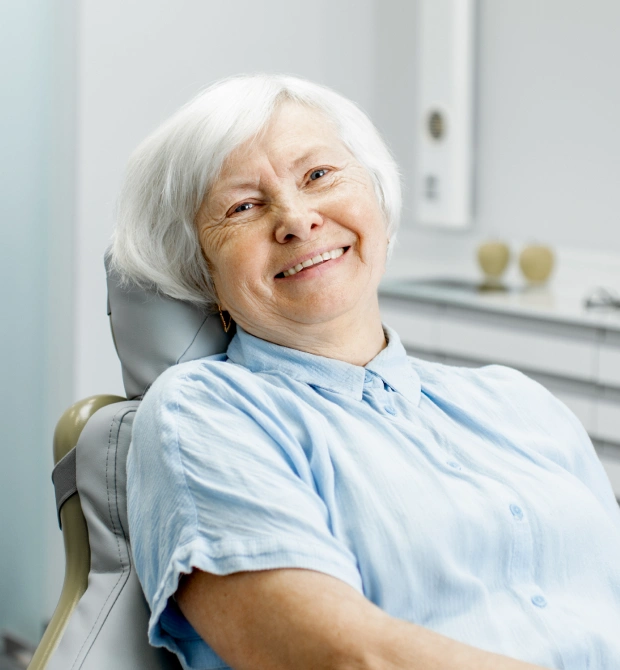 Senior woman smiling after root canal therapy