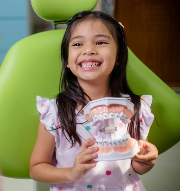 Young child smiling during a dental visit