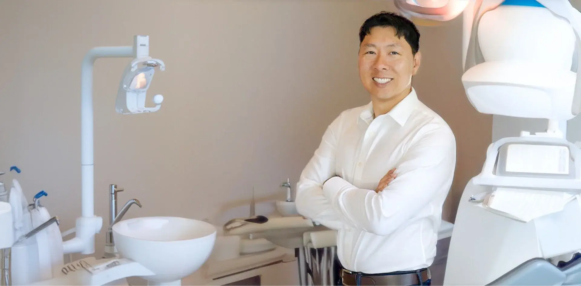 Dentist at Core Dentistry dental office in Frisco, TX welcoming new patients.